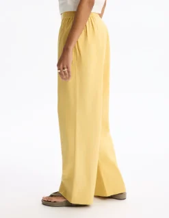 Celio Pantalon large - jaune^Femme Pantalons