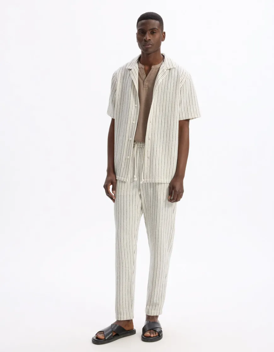 Celio Pantalon relaxed coton mélangé - ecru^Homme Pantalons