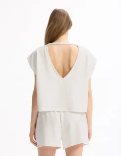 Celio T-shirt large sans manches - écru^Femme Sportswear
